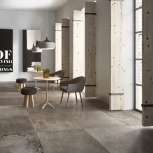 Modern cafe with minimalist design, featuring wooden panel walls, grey chairs around small wooden tables, large abstract art, and potted plants. Bright and airy ambiance.